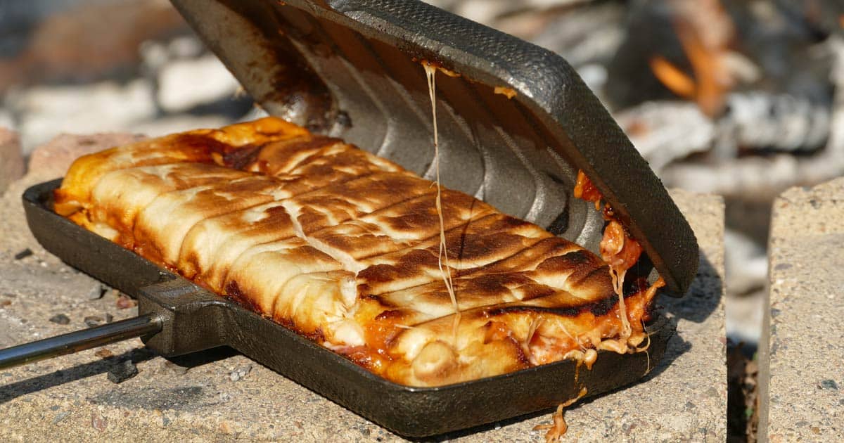 How to Amazing Make Pie Iron Pizza: The Campfire Calzone - Beyond The Tent