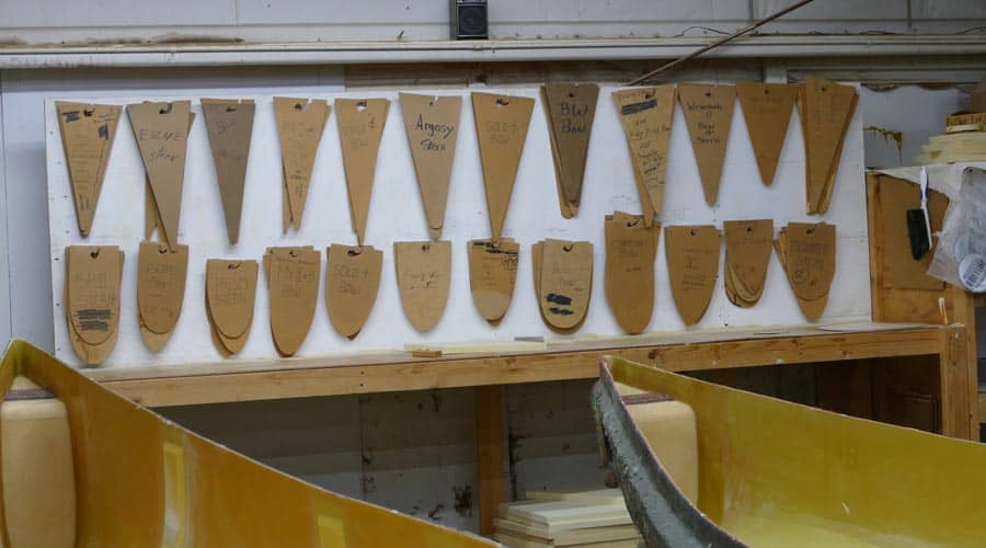 A photo showing the many different stern and bow shapes for Wenonah Canoe. 