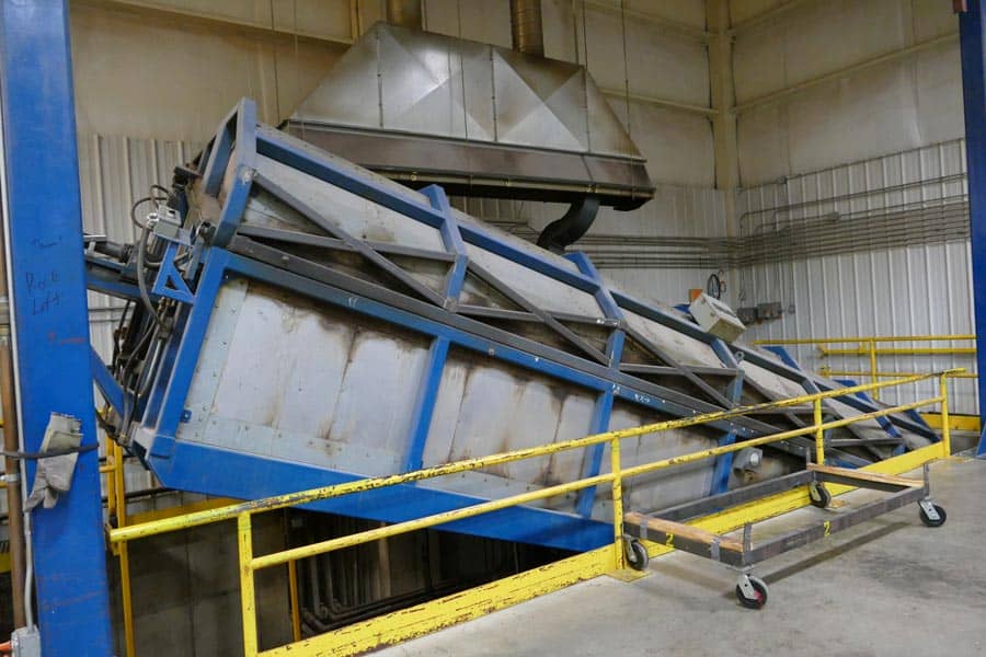 A large oven that rotates and bakes kayaks. 