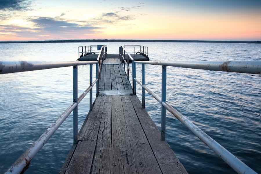 Pier or dock at sunrise or sunset at Millers Creek Reservoir near Munday, Texas.