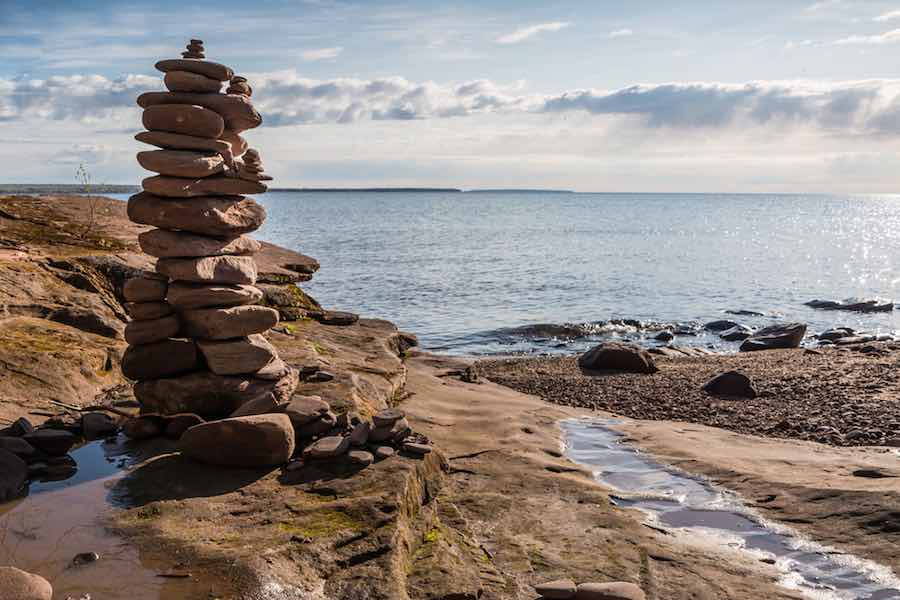 Cairn of rocks near a lake in Michigan.