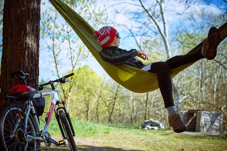 The Complete Hammock Camping Gear Setup and Checklist 1 Bicyclist Laying in a Camping Hammock