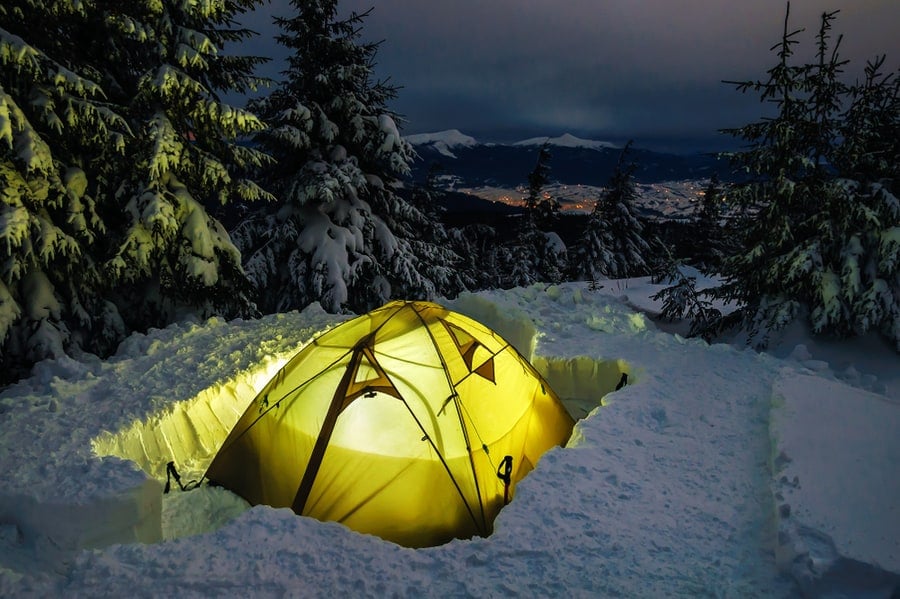 How to Stay Warm Camping in a Tent 1 Illuminated Winter Tent in Deep Snow
