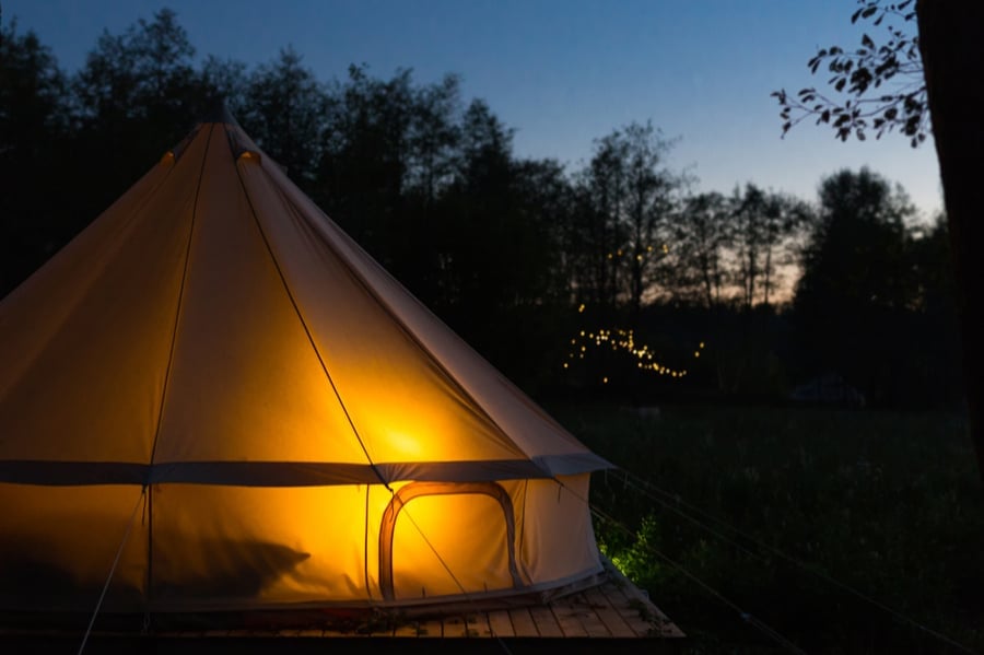 Glamping Tent at Dusk Illuminated from Inside
