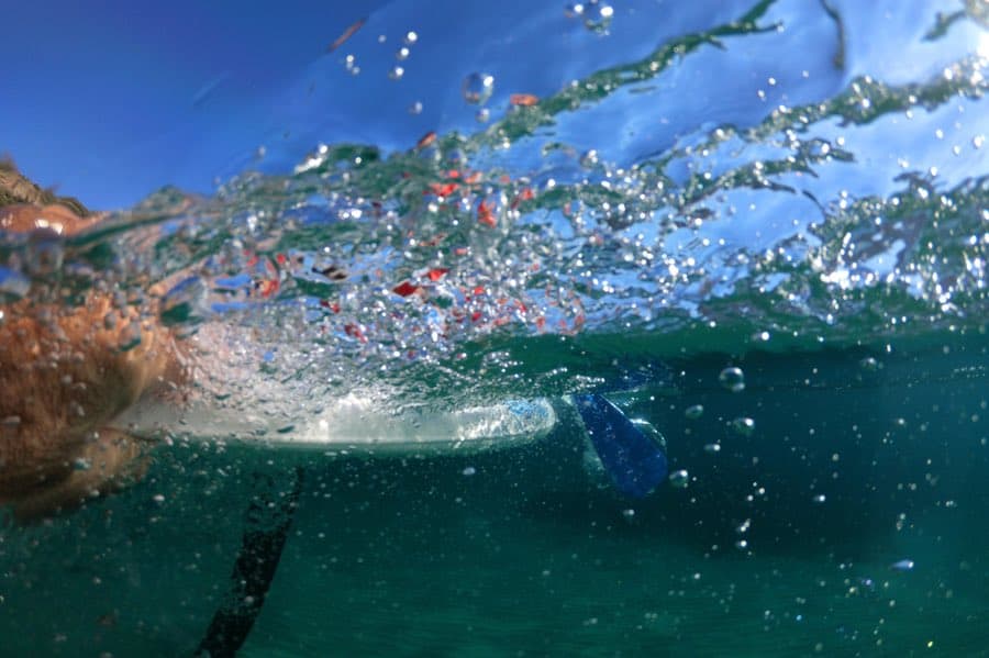Ultimate Beginner’s Guide to Stand Up Paddleboarding (SUP) 3 Stand Up Paddleboarding Through Water