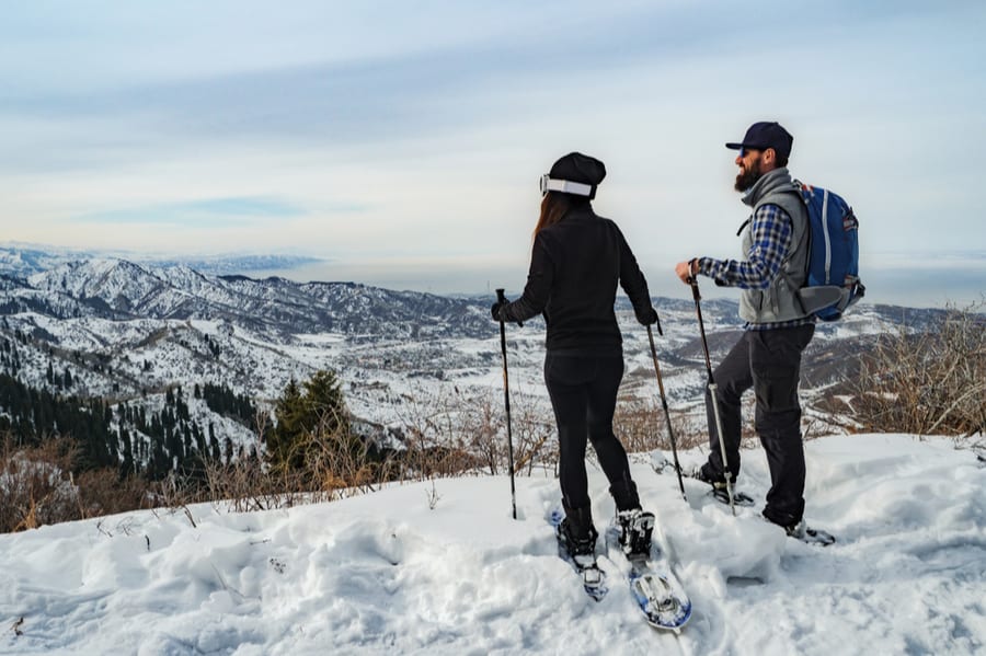 Couple Snowshoeing in Mountains