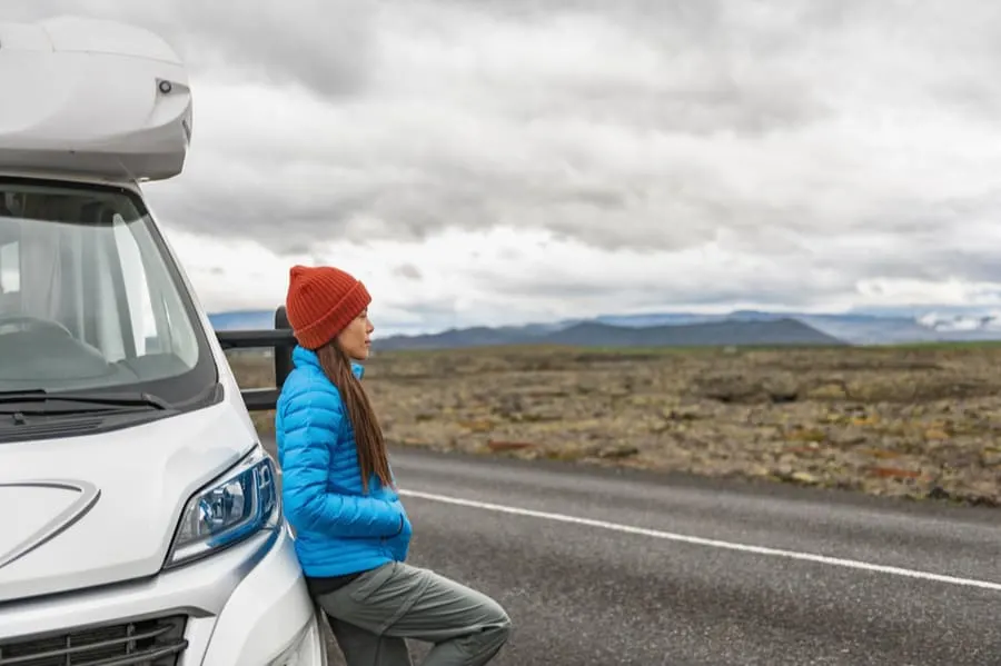 How to Prepare for Full-Time RV Living 7 Woman Leaning on RV