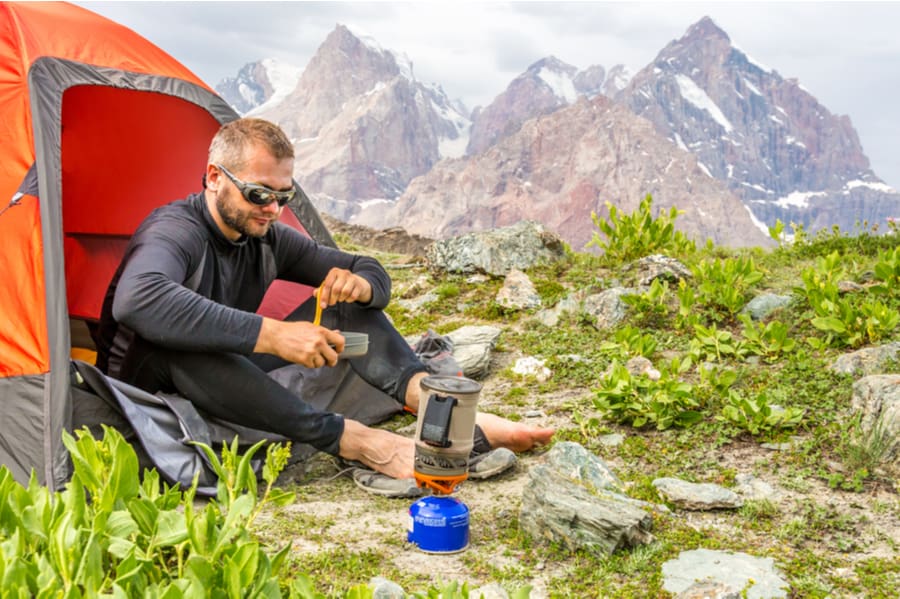 Camper Eating a Backpacking Meal