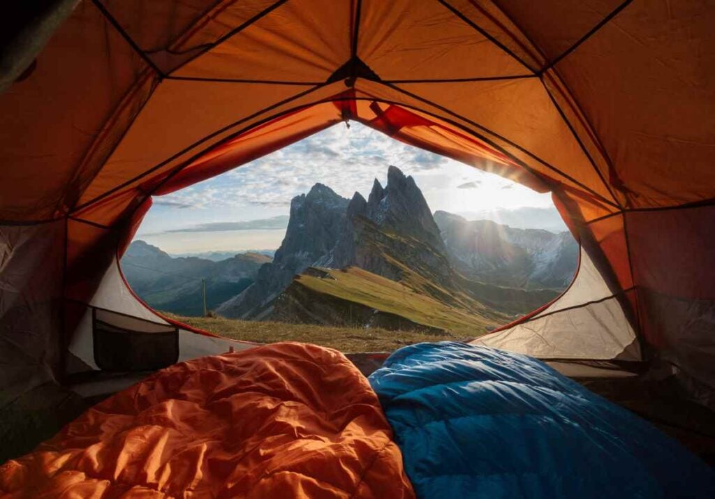 A view of mountains from inside a tent.