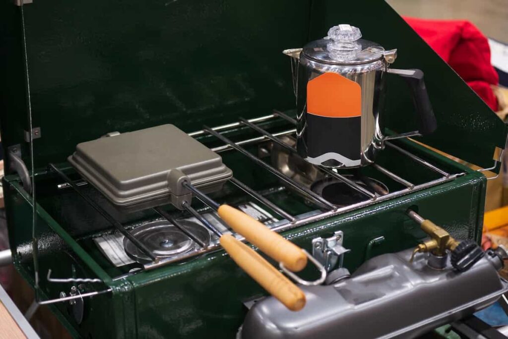 A camping stove and other cooking gear.