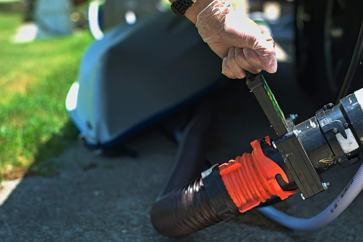 RV Maintenance 101: A Comprehensive Guide to Keeping Your Home on Wheels in Top Shape 9 Emptying RV waste tanks.