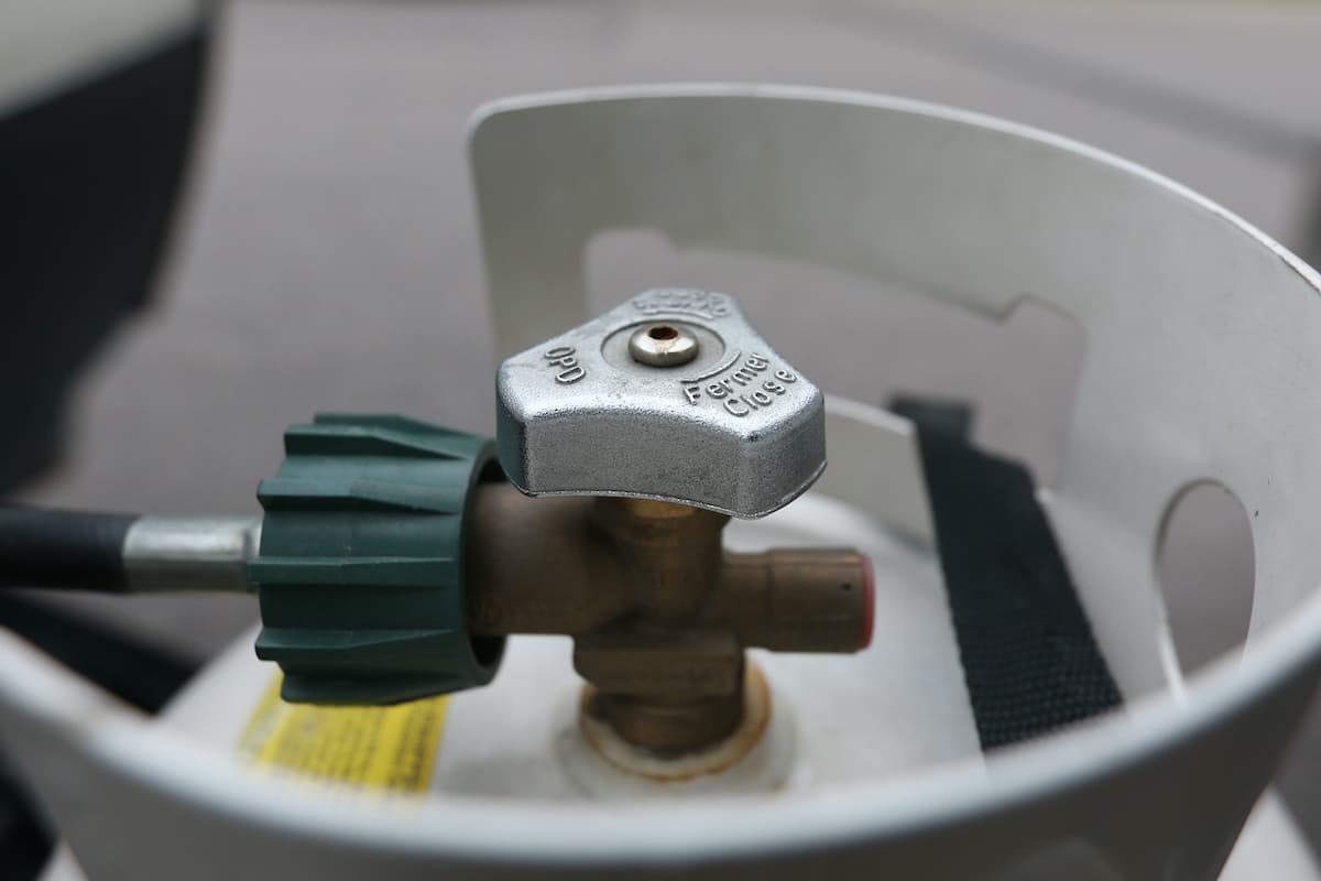 RV Maintenance 101: A Comprehensive Guide to Keeping Your Home on Wheels in Top Shape 5 Closeup of a propane tank and hose.