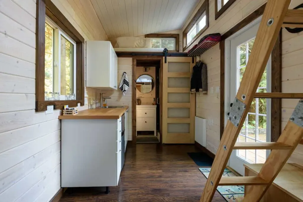 How to Start a Glamping Business in 2023: With Sample Business Plan! 6 The interior of a tiny home, a popular option for a glamping business.