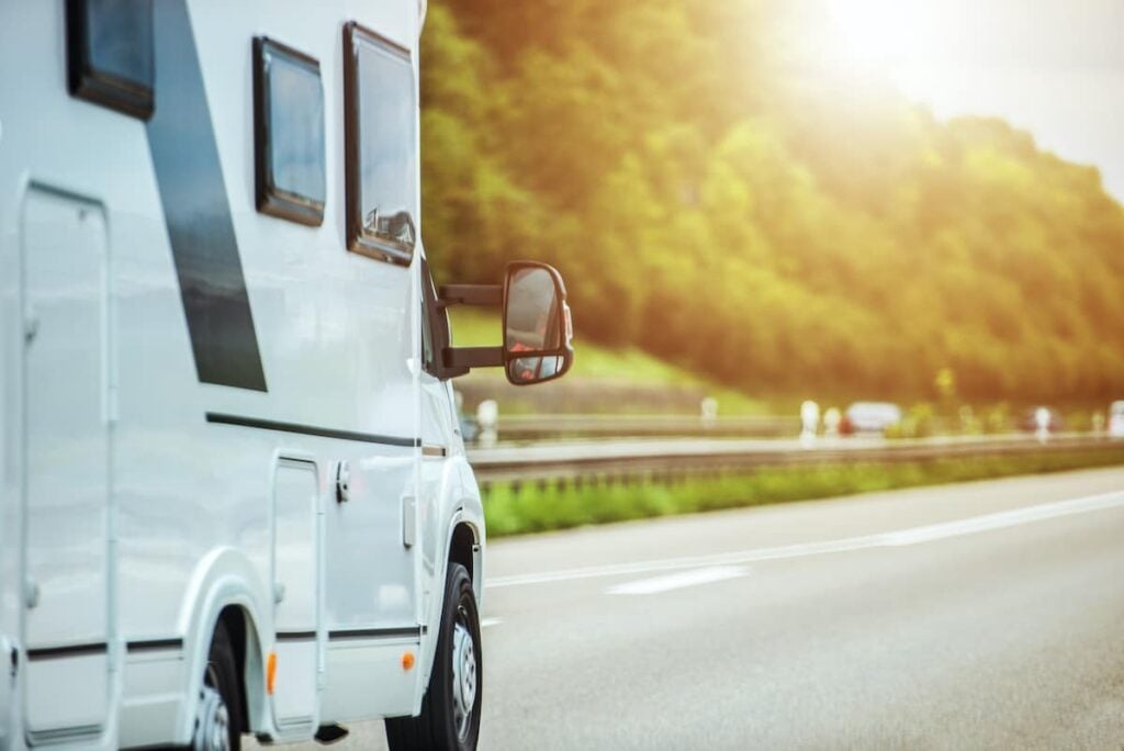 How to Dewinterize Your RV: Everything You Need to Know 1 An RV motorhome on the road. RV camping season starts with knowing how to dewinterize your RV.