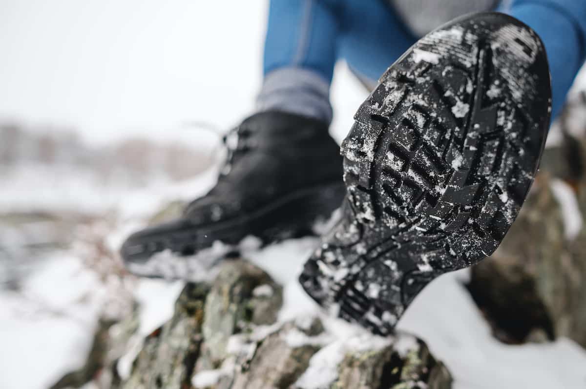 Stay Warm and Safe: 10 Winter Camping Essentials 4 Closeup view of the tread on winter hiking boots.