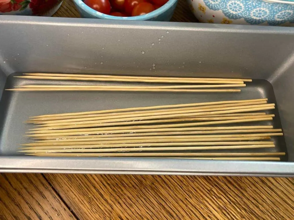 Grilled Veggie Kabobs: A Colorful and Healthy Camping Side Dish 4 Bamboo skewers soaking in water.