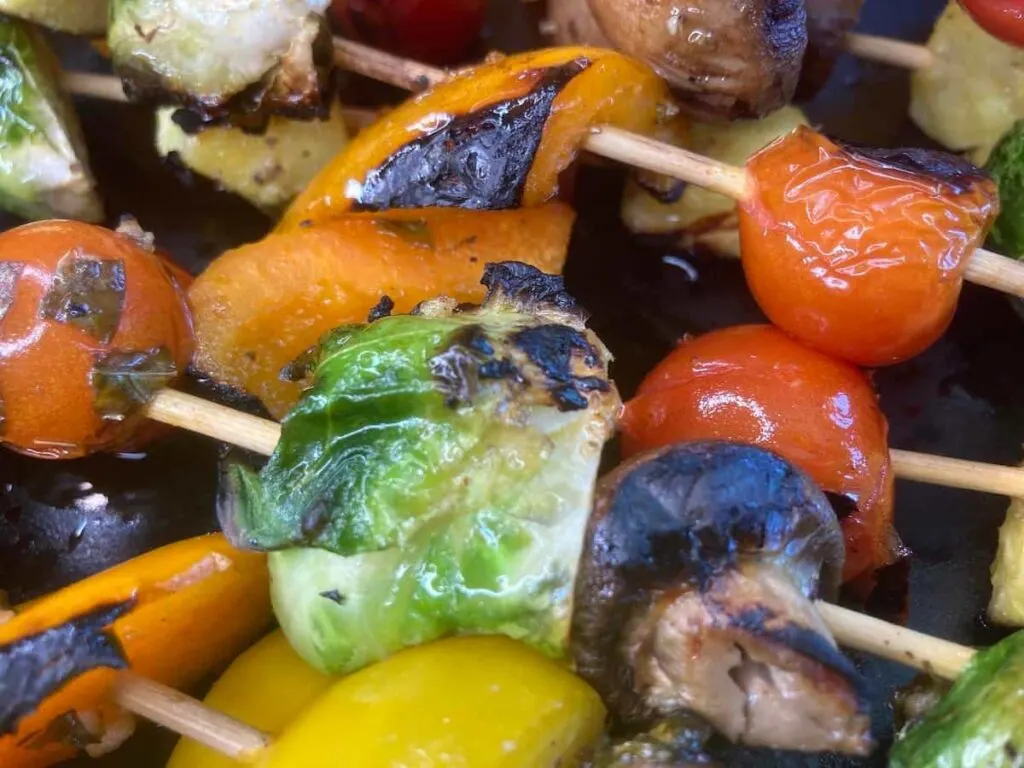 Grilled Veggie Kabobs: A Colorful and Healthy Camping Side Dish 1 A closeup view of colorful grilled veggie kabobs.
