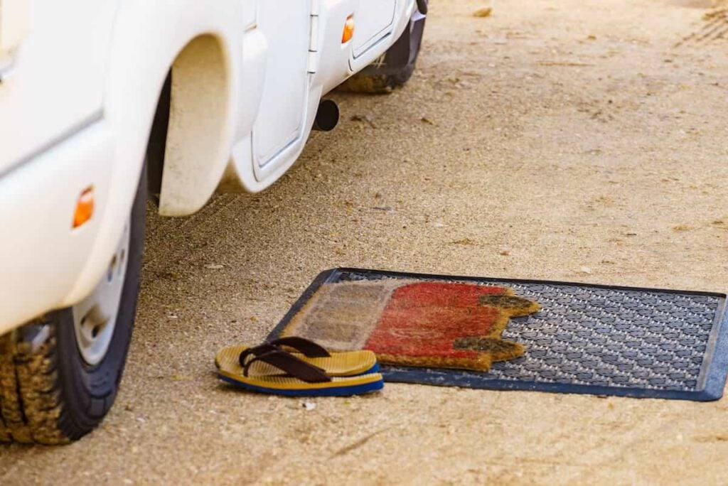 Mats in front of an RV door.