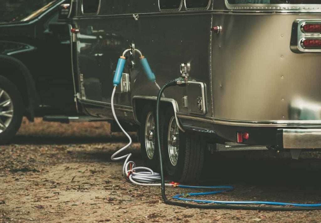 A water filter attached to a trailer water hose.