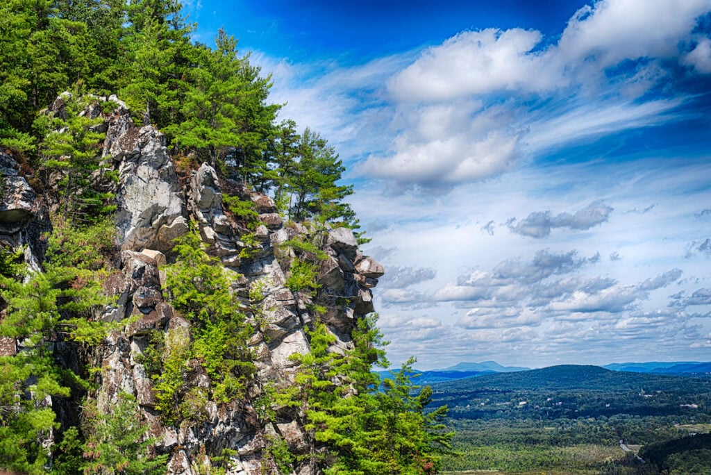 Rocky outcroppings on top of monument mountain in great barrington massachusetts on a sunny day.